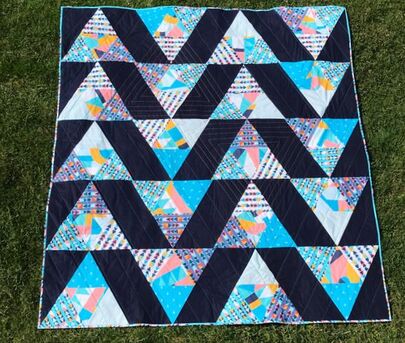 Colorful triangles on the quilt front!